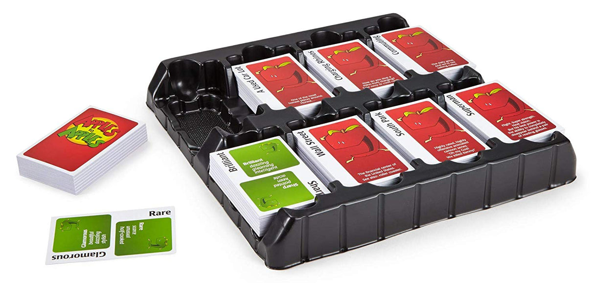 Apples to Apples card game with red Things cards and green Description cards organized in a black tray for family fun.
