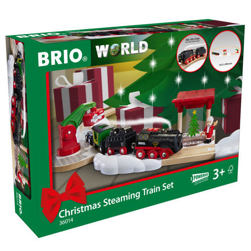 Steaming Christmas Train Set with battery-powered engine, snowy tracks, north pole station, and Santa Claus figure.