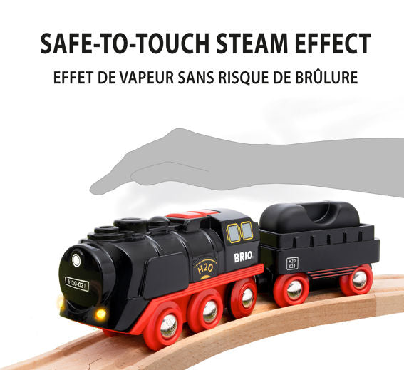 Steaming Christmas Train Set with safe-to-touch steam effect on black and red battery-powered engine on wooden tracks.