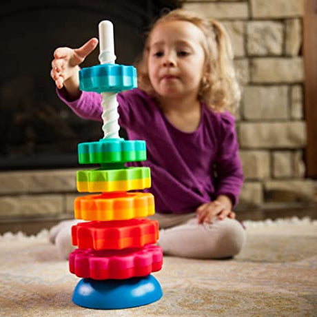 SpinAgain stacking toy with vibrant, dual-colored discs spinning on a corkscrew pole on a reversible wobble base.