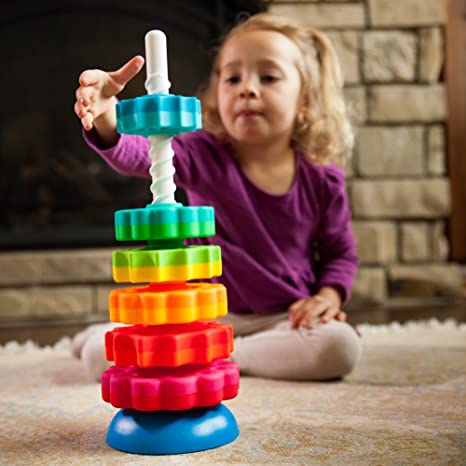 SpinAgain stacking toy with vibrant, dual-colored discs spinning on a corkscrew pole on a reversible wobble base.