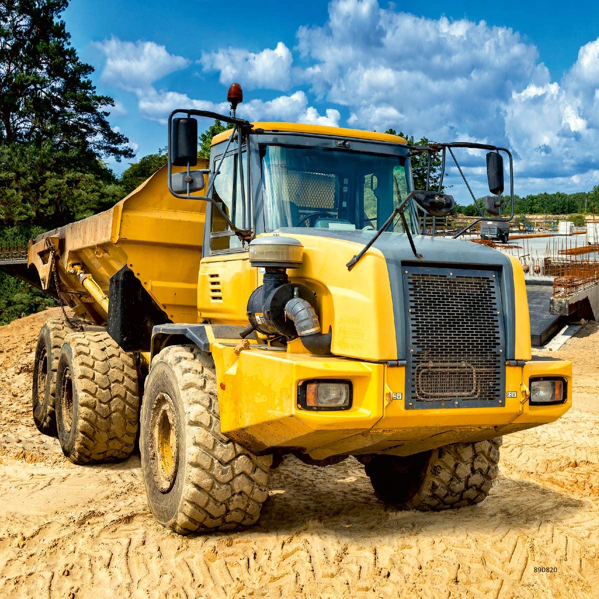 49pc Diggers at Work Puzzles featuring a yellow dump truck at a construction site under blue sky.