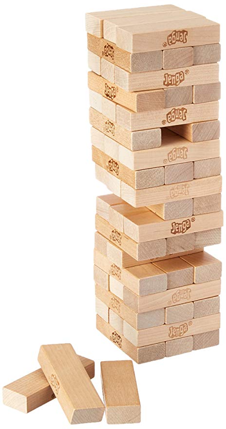 Jenga classic wooden block-stacking game showing a tower with some blocks removed and placed beside it.