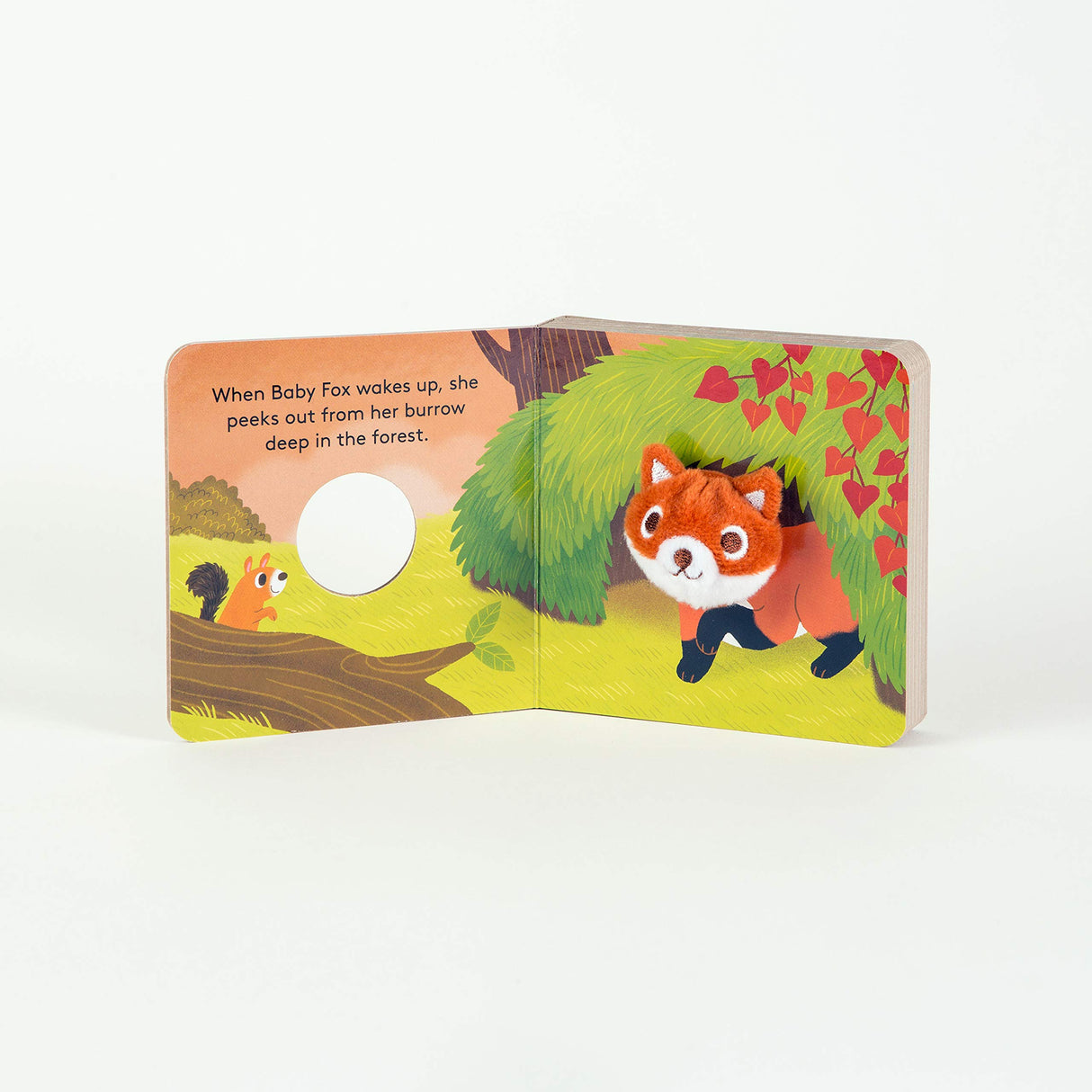 Baby Fox with Finger Puppet board book open showing the baby fox puppet and forest illustrations for toddlers.