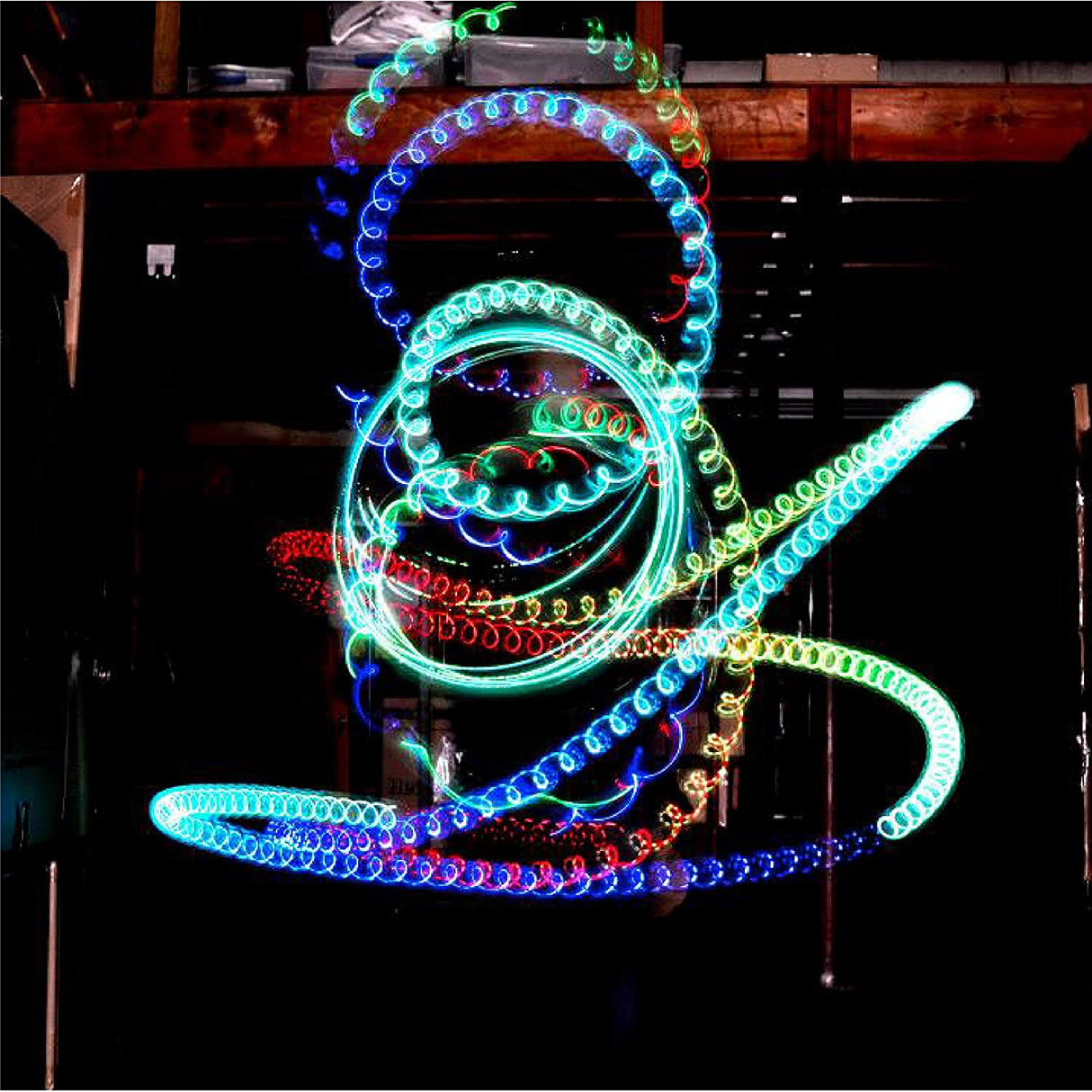 Yoyo | Light Up Spectrum creating colorful light trails with LED lights in a dark setting showing motion and fun.