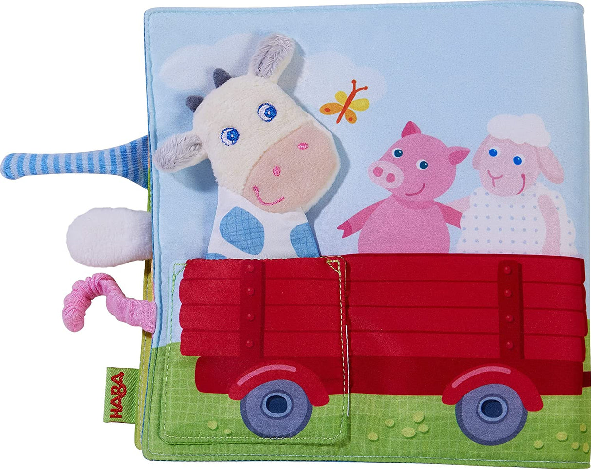 Down on the Farm Soft Book with Cow Puppet featuring colorful farm animals and interactive fabric elements for toddlers.