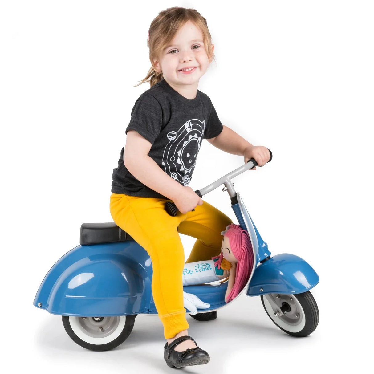 Child smiling while riding the Primo Ride On Blue scooter designed for toddlers aged 1 to 5 years.