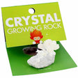 Crystal Growing Rock showing white crystal formations growing on a rock in a green display package.