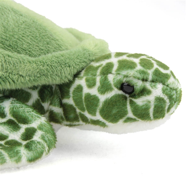Close-up of Turtle Tillie plush, a soft green sea turtle toy with realistic scale patterns and dark eyes.