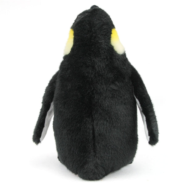 Emperor Penguin Waddles plush toy showing soft black fur and yellow ear patches, standing facing away against white background.
