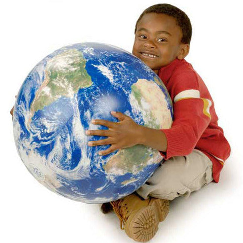Child sitting and hugging a 16-inch photo-realistic Inflatable Earth Ball globe with detailed satellite imagery.