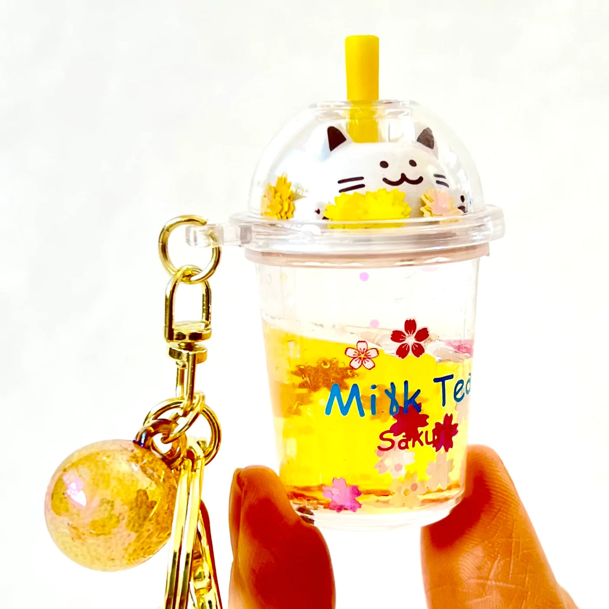 Kitty Boba Milk Keychain featuring a cat in a clear cup with yellow drink, keyring, and clip for easy attachment.