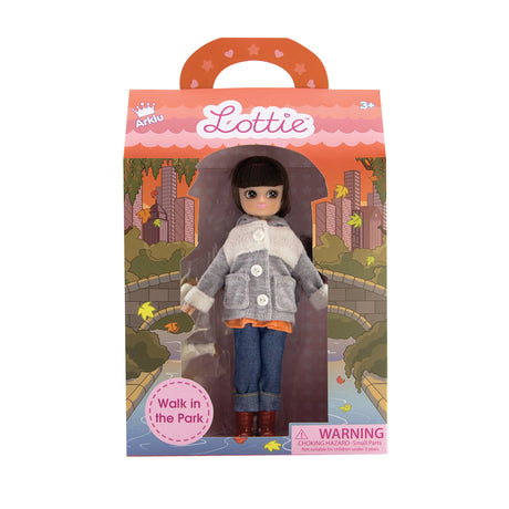 Lottie Walk in the Park doll wearing cozy bunny coat, fox blouse, boots, and jeans in park-themed packaging.