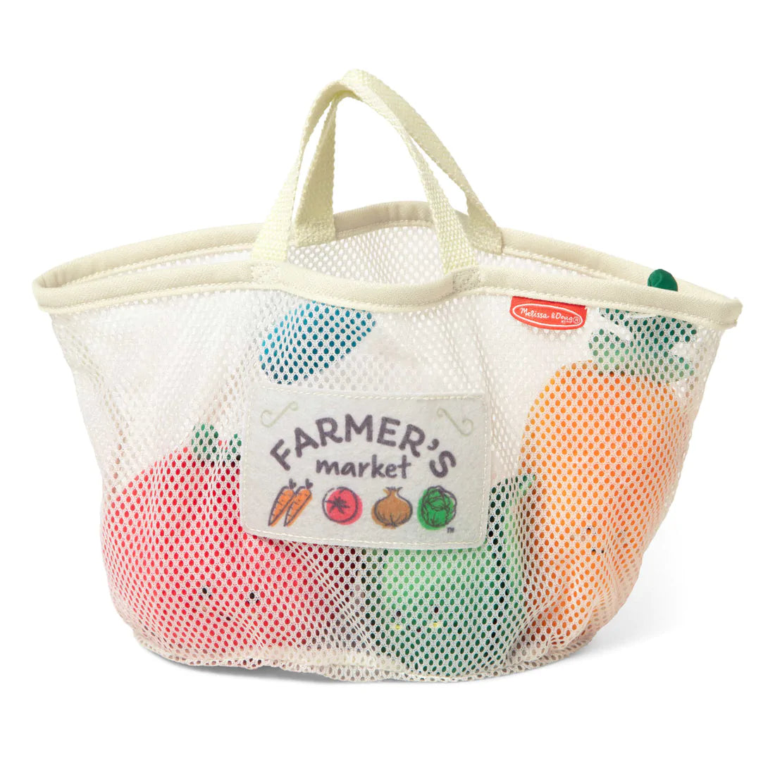 Fill & Spill Market Basket mesh tote with plush farmer’s market toys including carrot, tomato, milk bottle, and lettuce for sensory play.