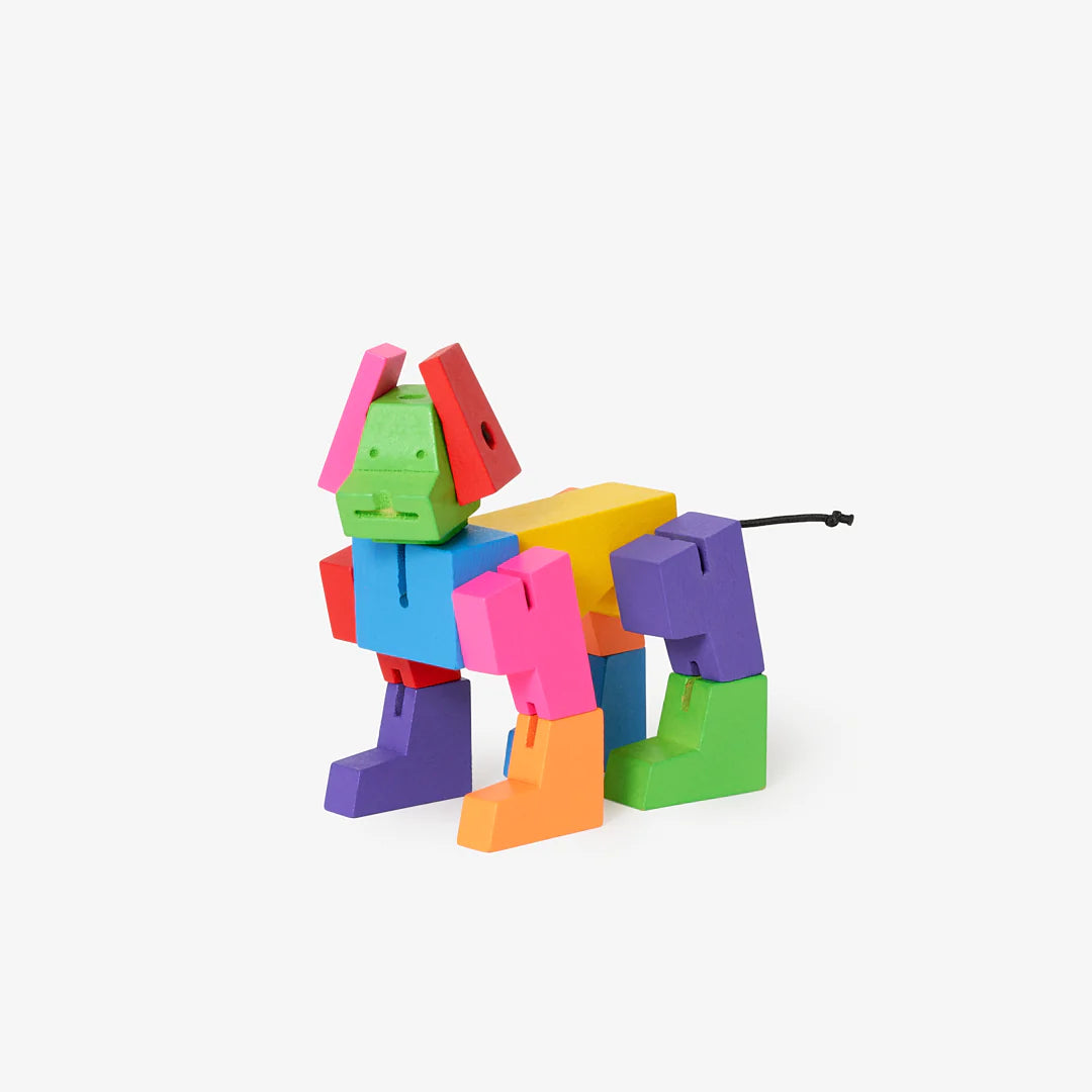 Cubebot Milo Multicolor Micro wooden dog toy in bright colors, foldable into many poses and back into a cube.