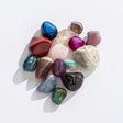 Bag of Rocks! showing a colorful assortment of natural and dyed stones including agate, amethyst, and quartz.