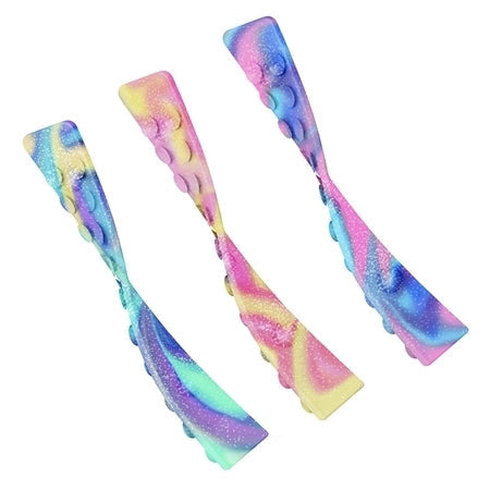 Three colorful OMG Octopop Glitter suction cup fidget toys with glitter and swirl patterns on a white background.