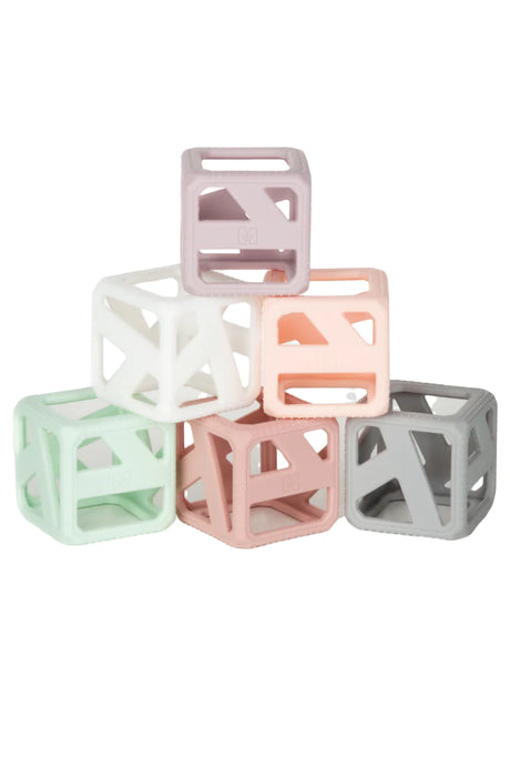 Stack & Chew Pastel Cubes in soft colors, BPA-free silicone teething and stacking toy for babies 3 months and up.