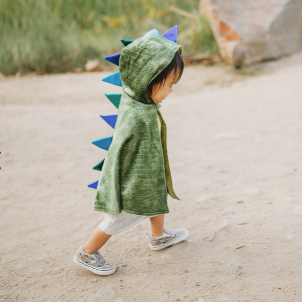 Baby Dragon Cape | Size 2-3 shown on child wearing a soft green crushed velvet cape with foam spikes and Velcro closure.