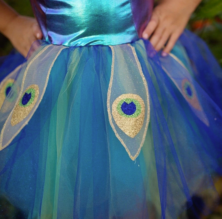Pretty Peacock Dress & Headband featuring a multicolored tulle skirt with glitter peacock feather petals.