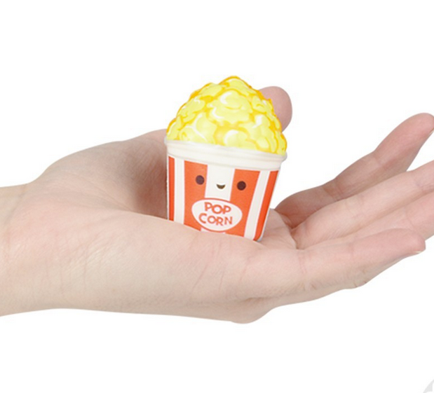 Fun Food Micro Squishy popcorn toy held in hand, mini slow rise squish measuring about 2 inches.
