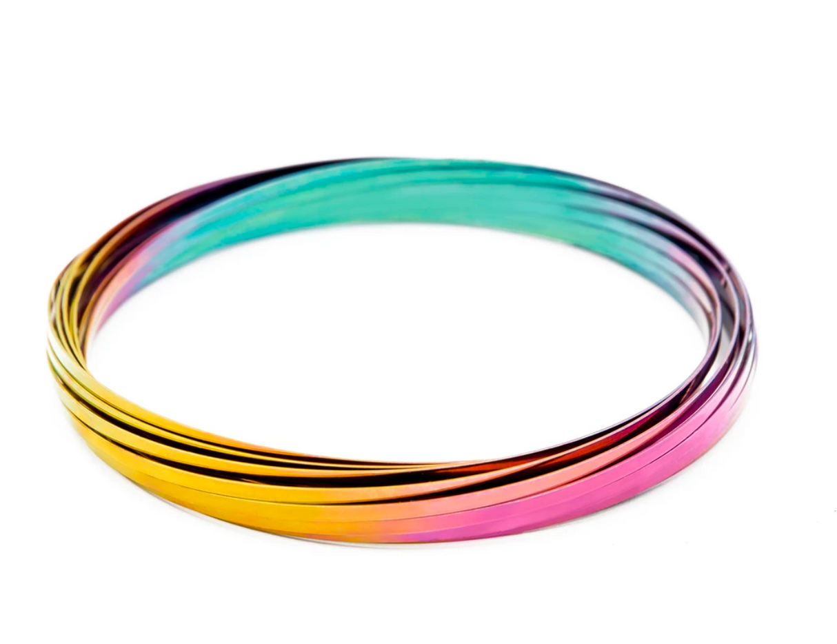 Mozi - Iridescent geometric sensory spring toy with 13 intertwined stainless steel coils in vibrant colors.