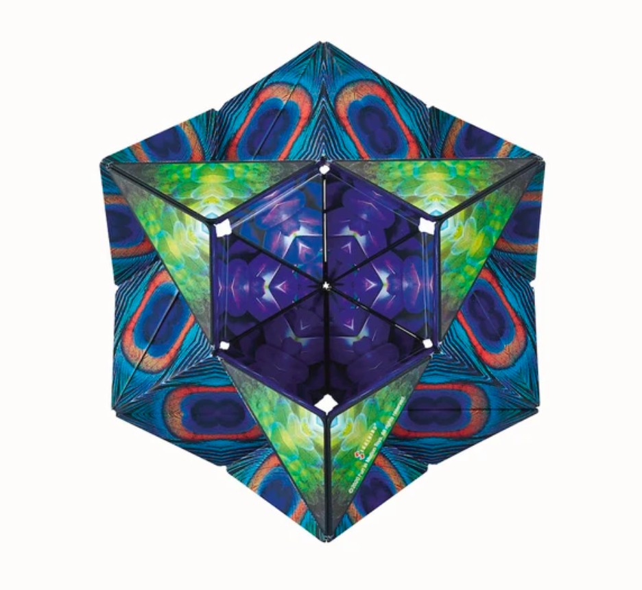 Shashibo | Wings magnetic puzzle cube with vibrant blue, green, and purple geometric wing patterns, shape-shifting design.