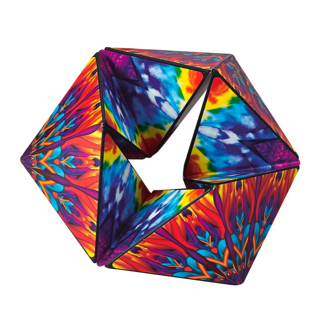 Karmagami sensory toy with vibrant colorful designs, infinitely flipping and transforming like a calming kaleidoscope.