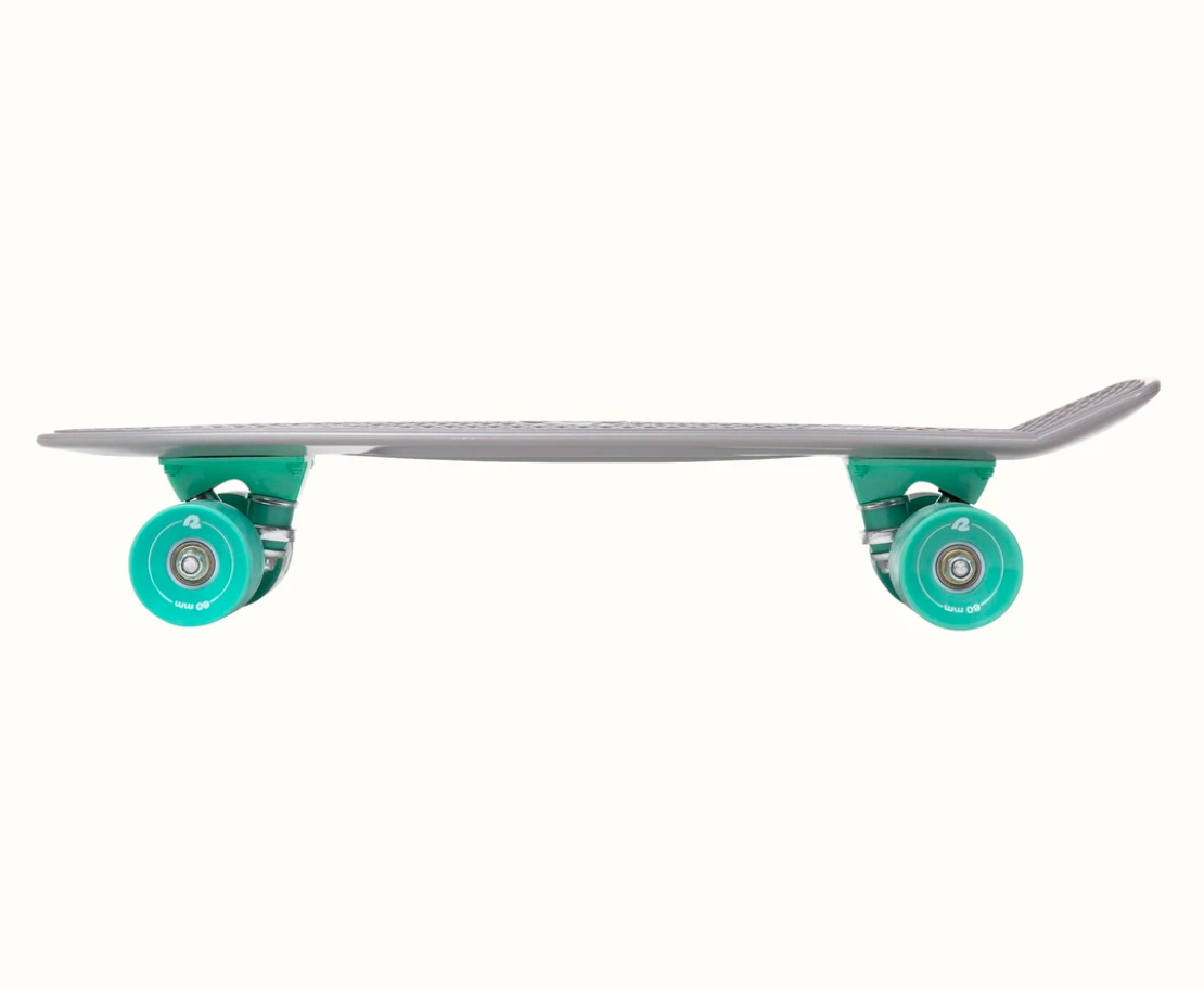 Quip Mini Cruiser Skateboard | Shark side view highlighting teal wheels and slim gray deck for easy commuting.
