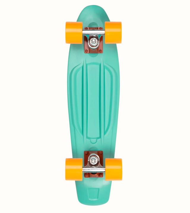 Quip Mini Cruiser Skateboard Seafoam with bright orange wheels and durable flexible plastic deck for smooth cruising.