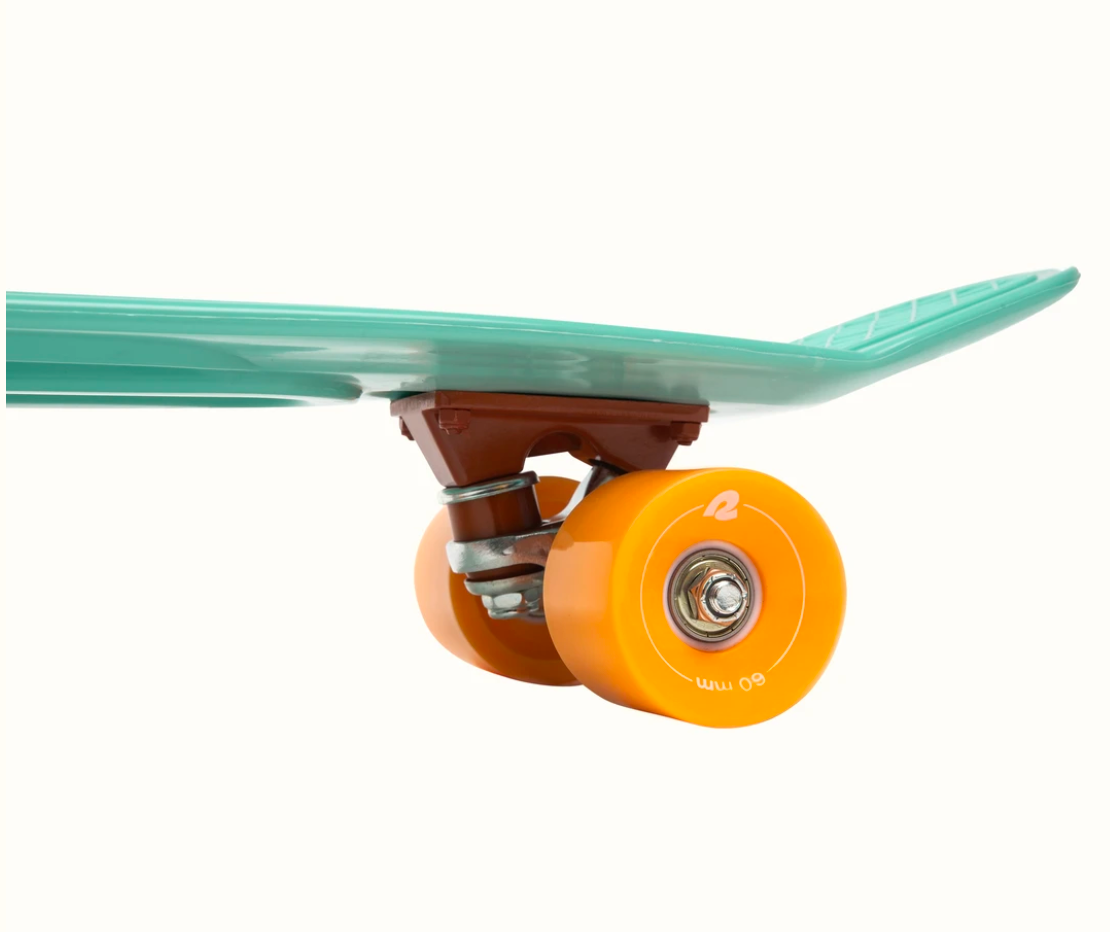 Quip Mini Cruiser Skateboard Seafoam with orange soft wheels and flexible 70’s-style plastic deck for smooth rides.