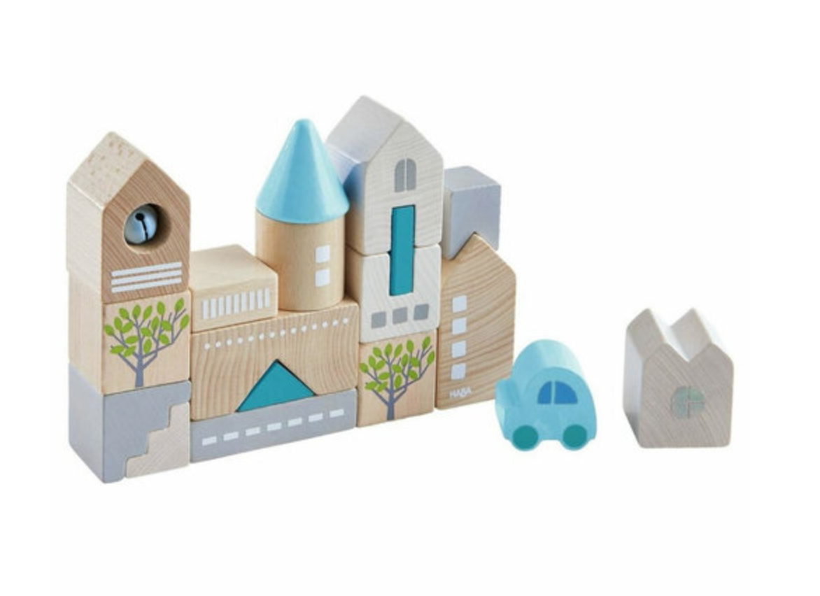Bad Rodach Wooden Building Blocks set with painted wooden blocks depicting buildings and a small blue car for toddlers.