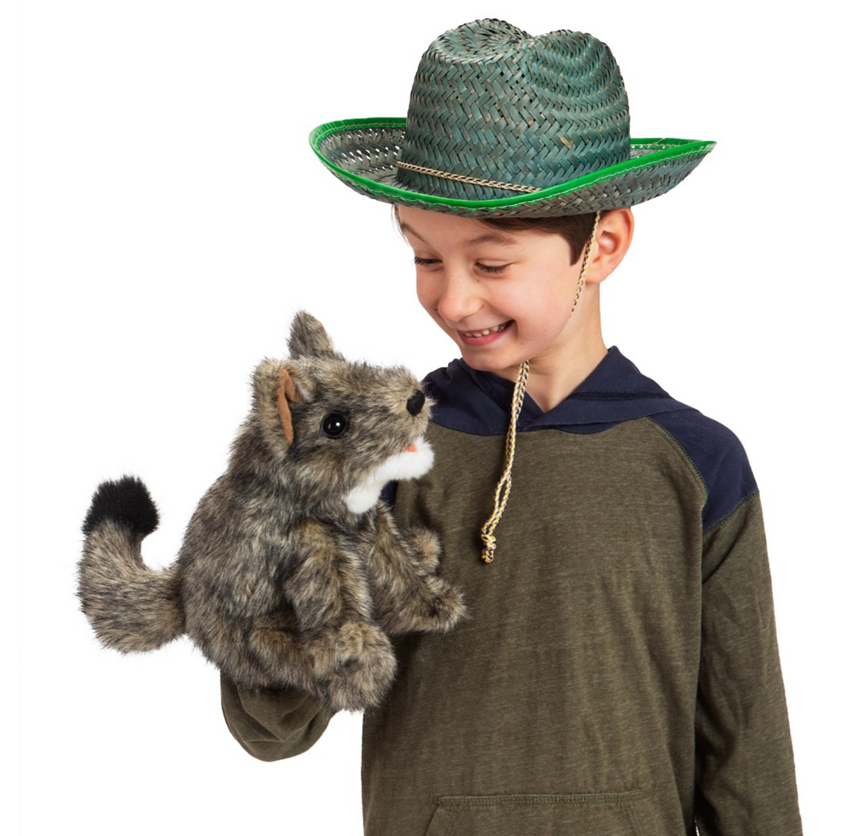 Child wearing a green hat playing with a furry, movable mouth Coyote Puppet in classic coyote pose.