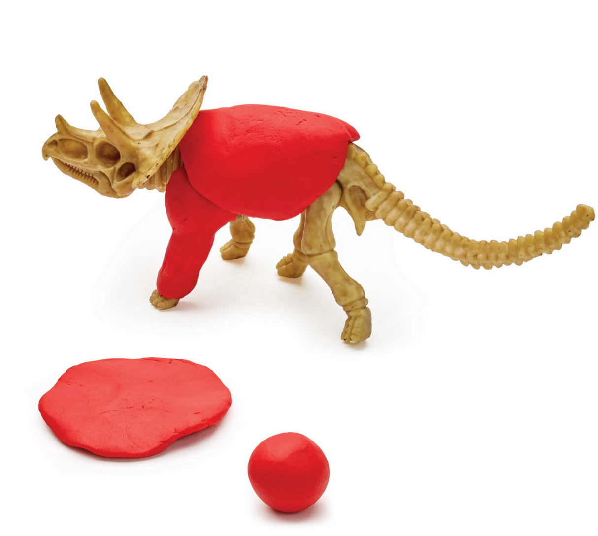 Create with Clay Dinosaurs showing a triceratops skeleton partially covered with red modeling clay on white background.