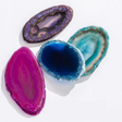 Rock | Dyed Agate Slice in vibrant purple, blue, teal, and pink colors showcasing natural patterns and texture.