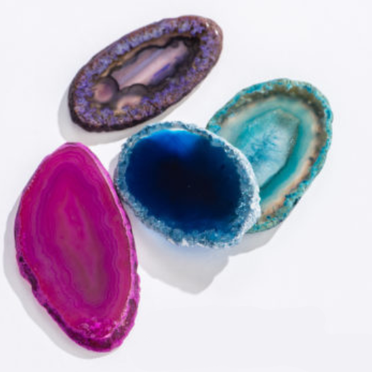 Rock | Dyed Agate Slice in vibrant purple, blue, teal, and pink colors showcasing natural patterns and texture.