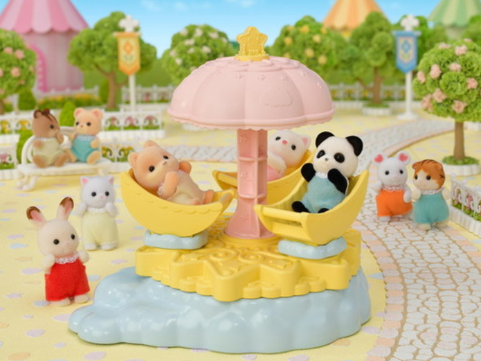 Baby Star Carousel with moon-shaped seats and star parasol featuring Pookie Panda baby figure in a night-themed playset.
