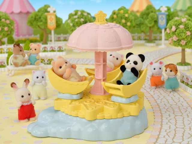 Baby Star Carousel with moon-shaped seats and star parasol featuring Pookie Panda baby figure in a night-themed playset.