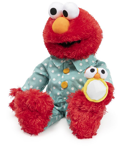 Bedtime Elmo plush in blue polka-dot pajamas holding a glowing flashlight, soft and huggable for toddlers.