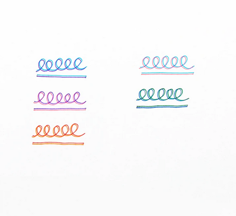 Colorful swirls and lines made by Seeing Double Felt Tip Markers showing dual coordinating colors on each fine tip.