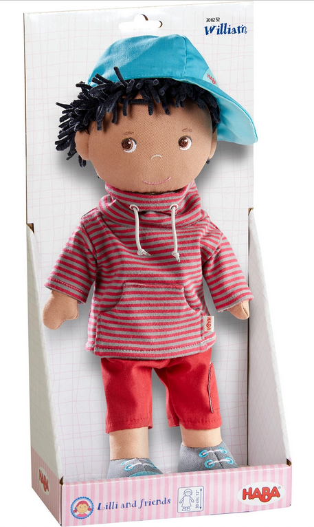 Soft Doll | William wearing a striped hoodie, red pants, blue cap, and padded body with sewn-on shoes in packaging.