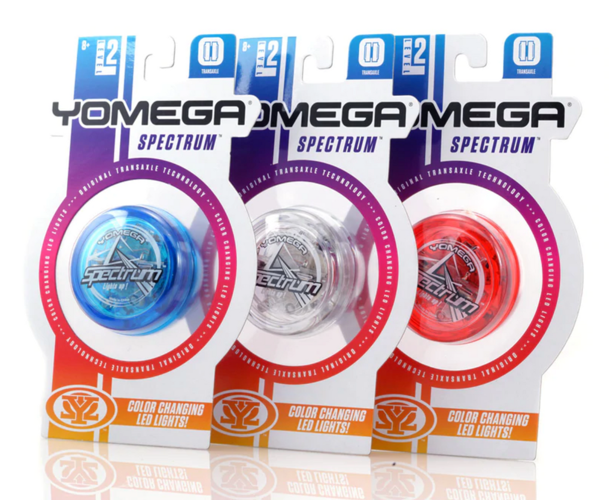 Yomega Spectrum Light Up Spectrum yo-yos in blue, clear, and red with color-changing LED lights in packaging.