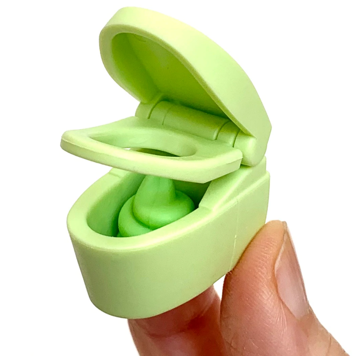 Japanese Eraser Toilet in green held between fingers, showing the open lid and puzzle eraser inside.