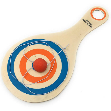 Bounce Back Paddle Ball wooden paddle with elastic cord and attached rubber ball featuring a bull’s eye target design.