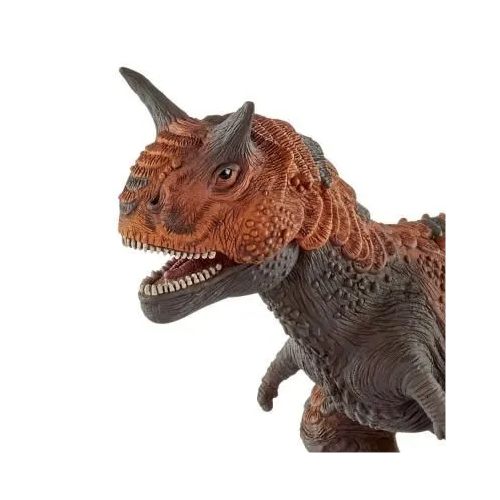 Detailed close-up of the Carnotaurus dinosaur toy showing sharp teeth and textured skin in friendly tones.