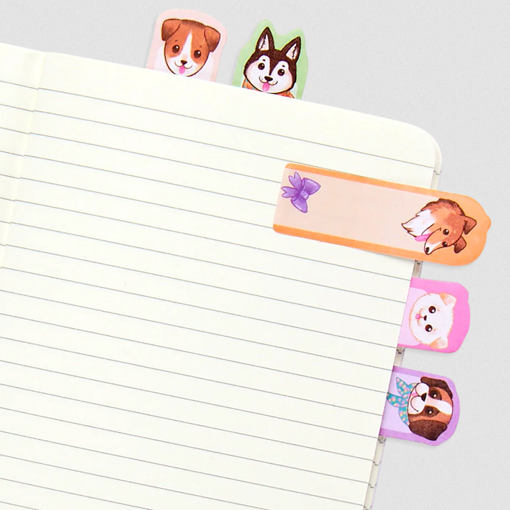 Note Pals Pups sticky note tabs featuring adorable illustrated dogs used as playful page markers in a notebook.