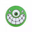 Waboba Super Flying Head foldable silicone disc with a green one-eyed monster face for outdoor play.