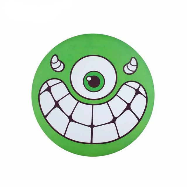Waboba Super Flying Head foldable silicone disc with a green one-eyed monster face for outdoor play.
