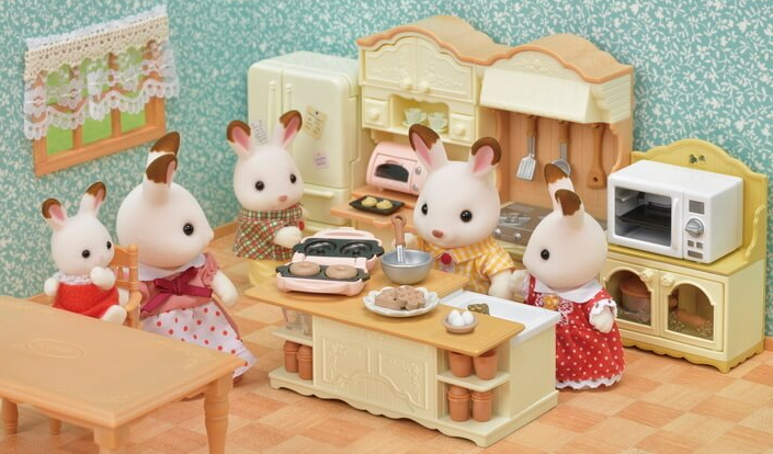 Kitchen Island with sink and appliances including mixer and waffle maker, perfect for family playtime with doughnut molds.