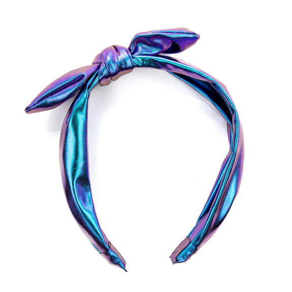 Midnight Metallic Headband in foiled fabric with a purple to blue sheen and a chic bow detail for stylish flair.
